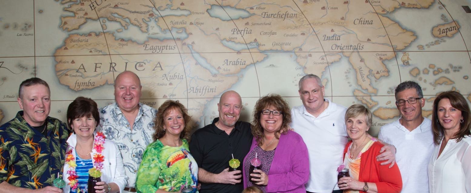 Group celebration with world map