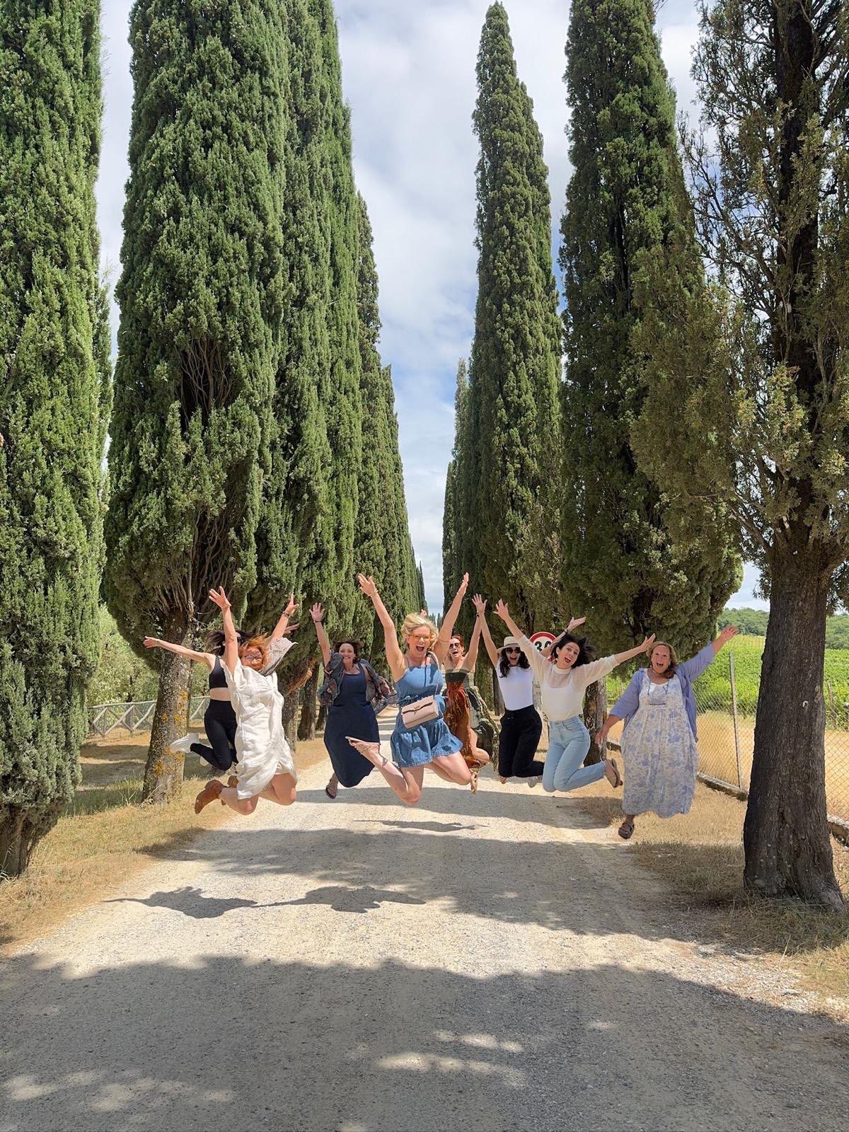 Group of friends jumping in celebration